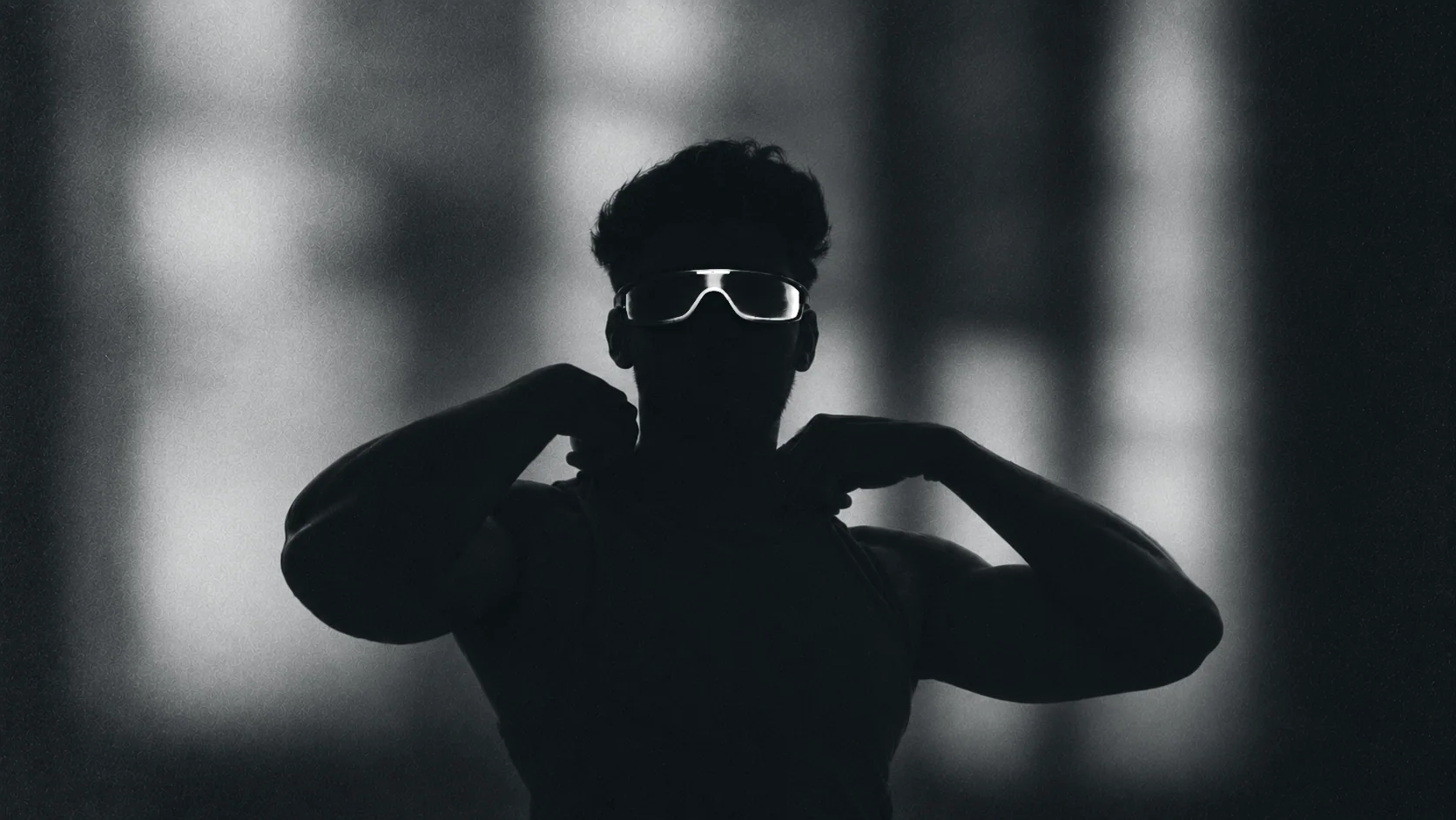 A GodSpeed athlete in silhouette, visor lit white
